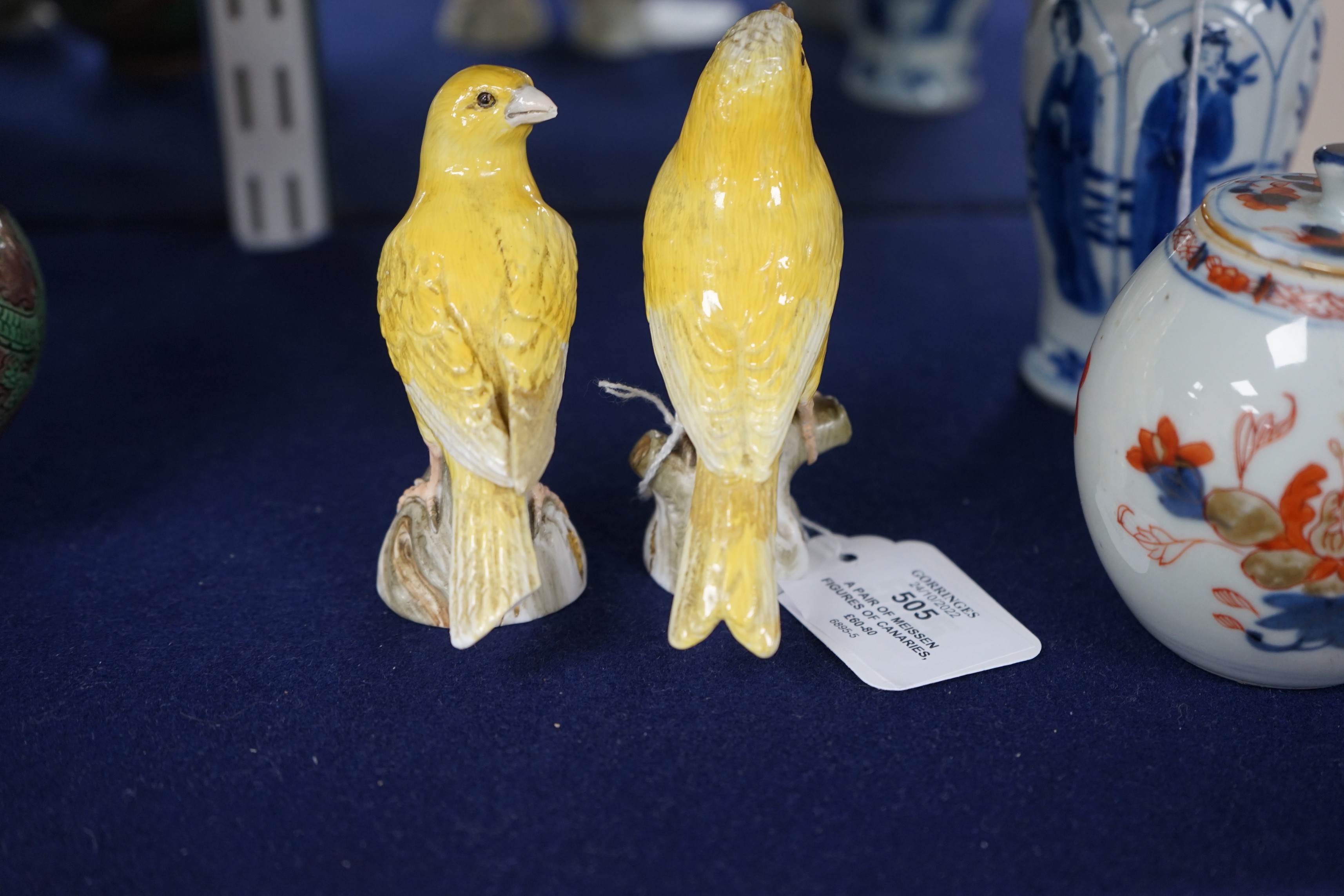 A pair of Meissen figures of canaries, 10cm tall